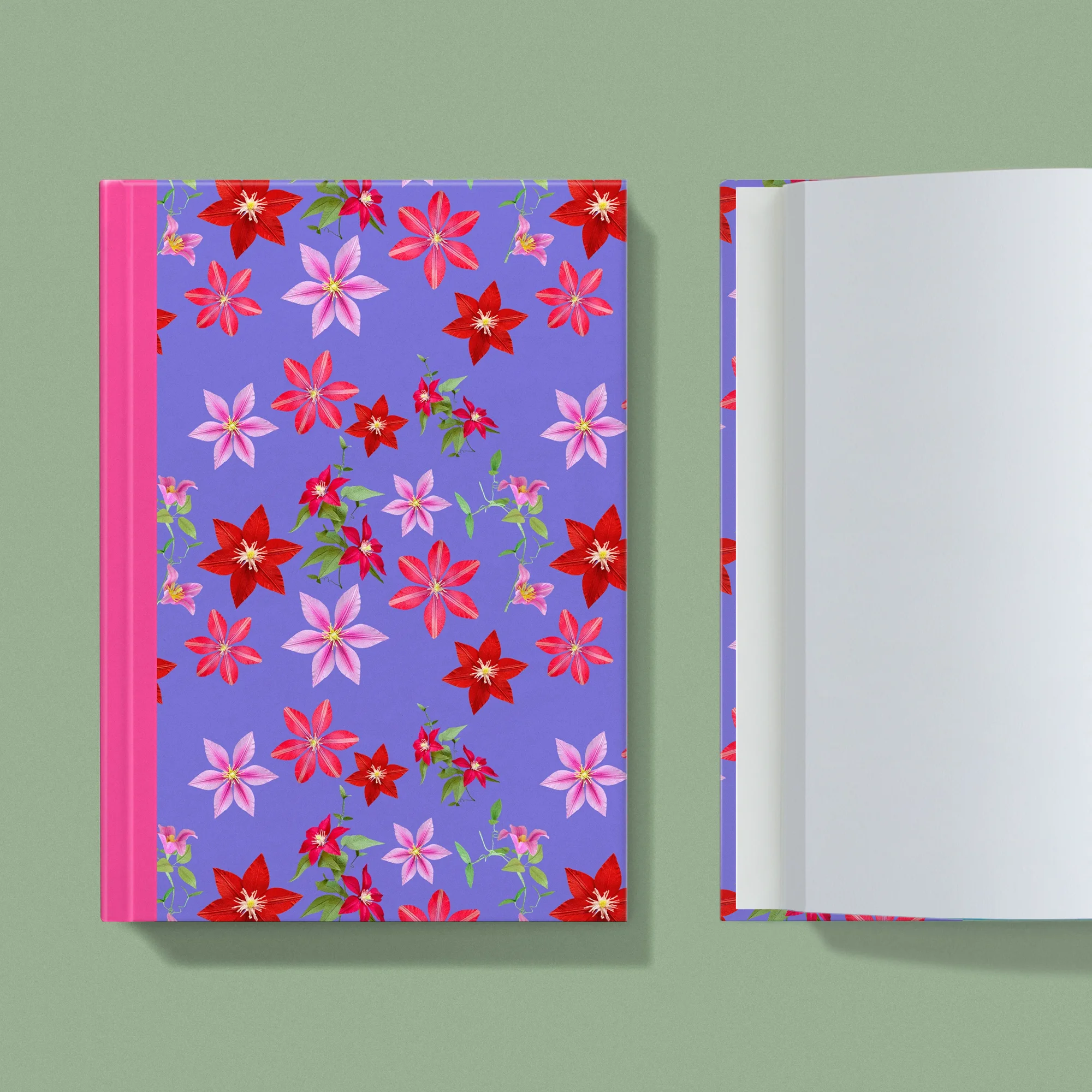 Notebook with a image of colourful handcrafted paper clematis on a purple background colour by paper artist Daphne Fitch.