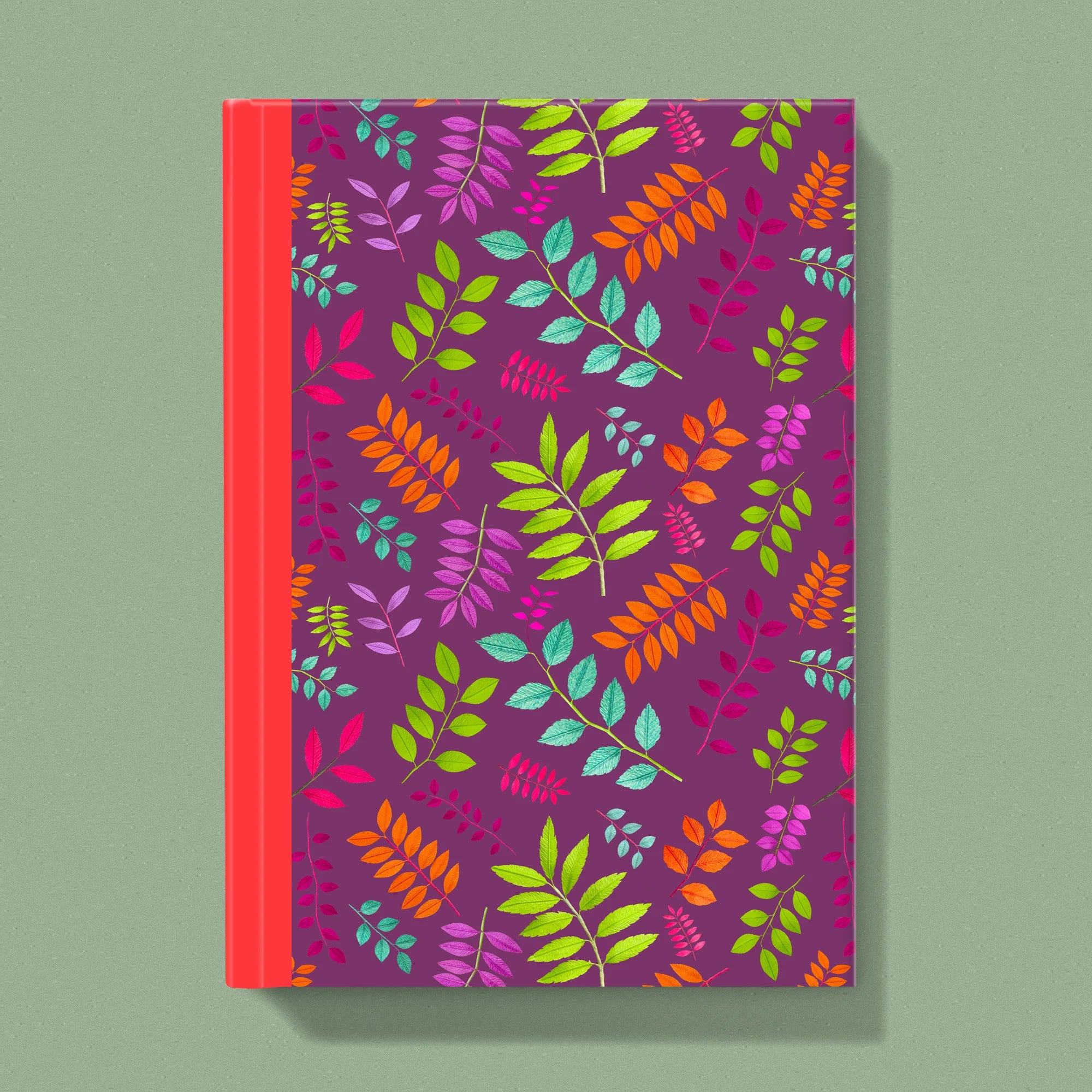 Notebook with a image of colourful handcrafted paper foliage on a plum background colour by paper artist Daphne Fitch.