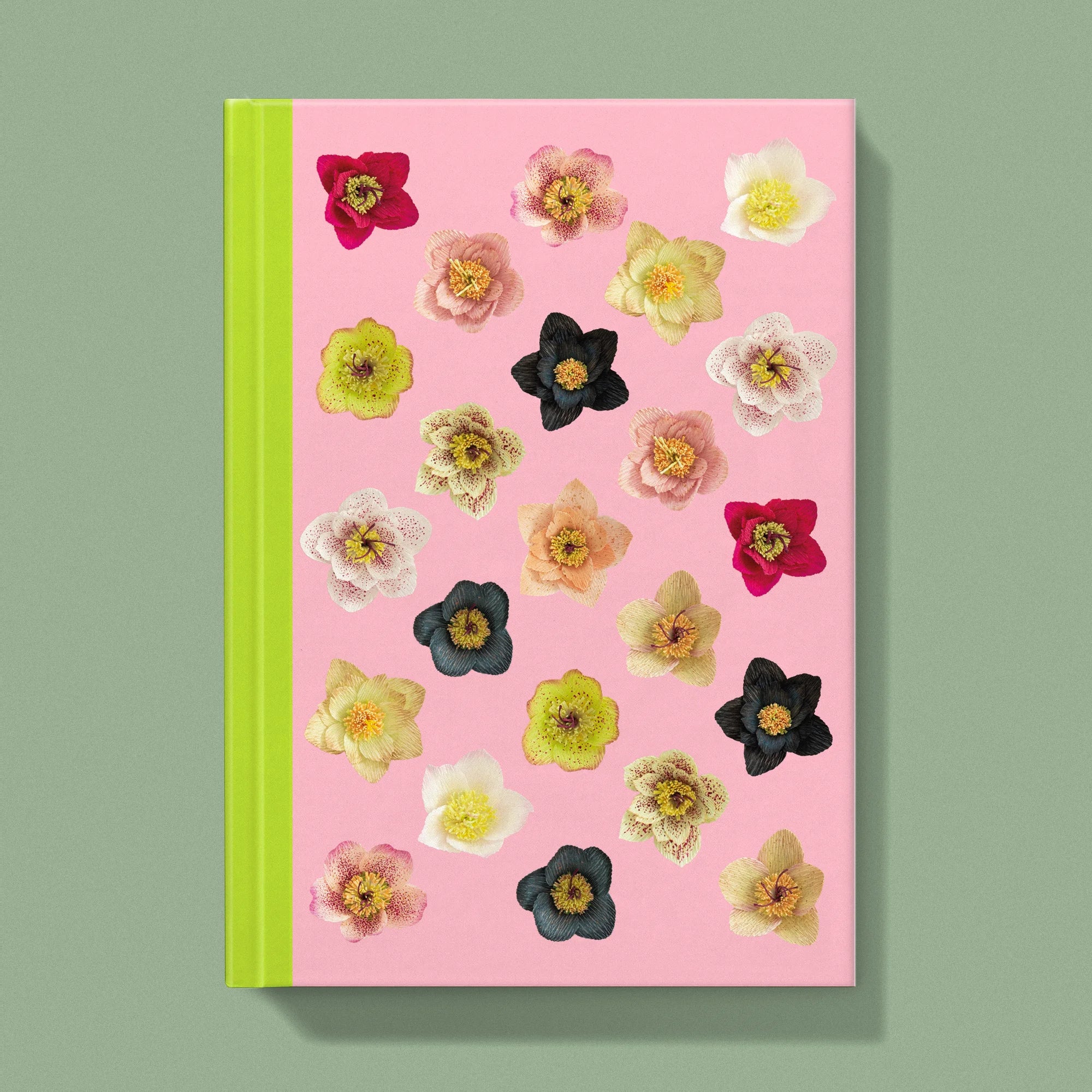 Notebook with a image of colourful handcrafted paper helebores on a light pink background colour by paper artist Daphne Fitch.