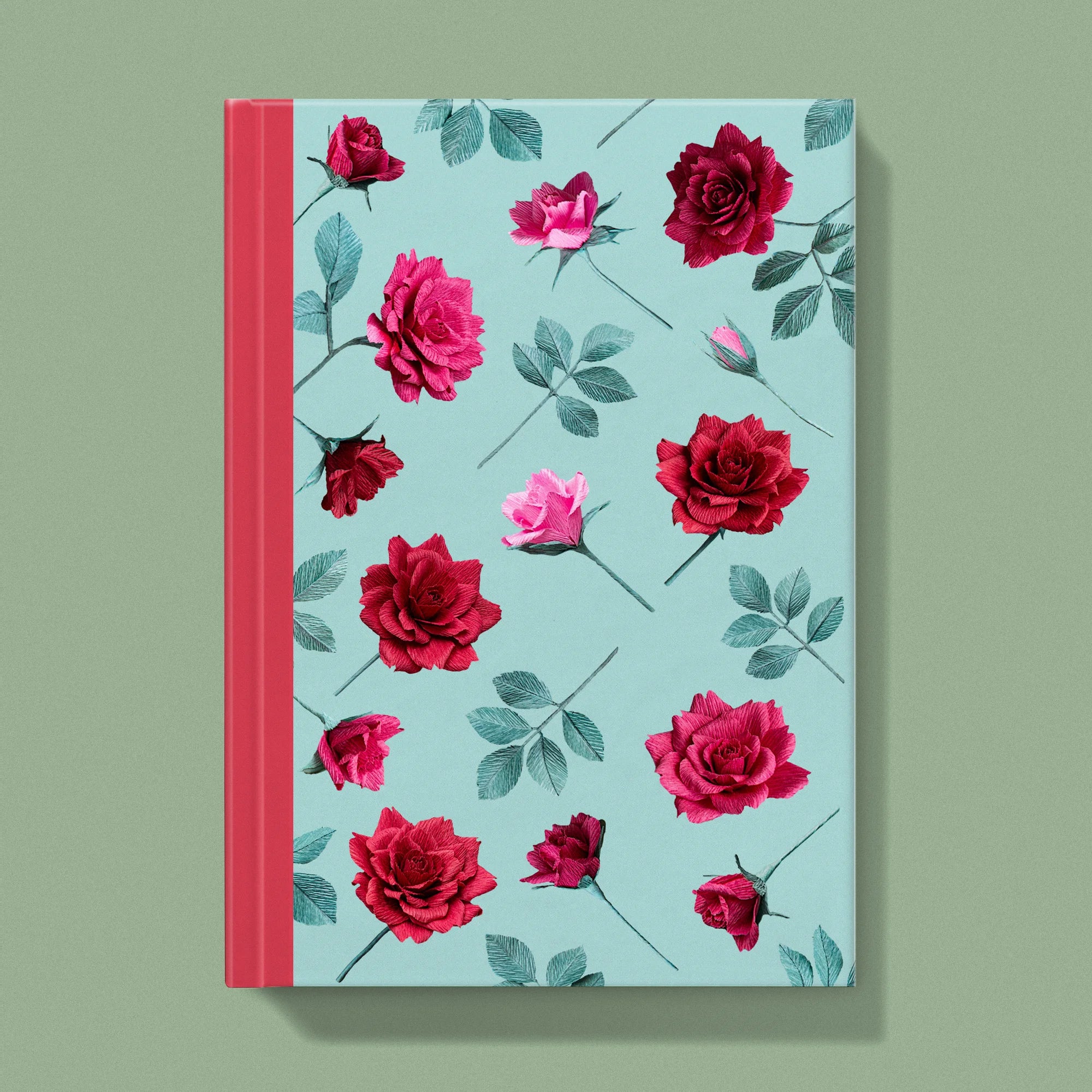 Notebook with a image of colourful handcrafted paper red and pink roses on a light blue background colour by paper artist Daphne Fitch.