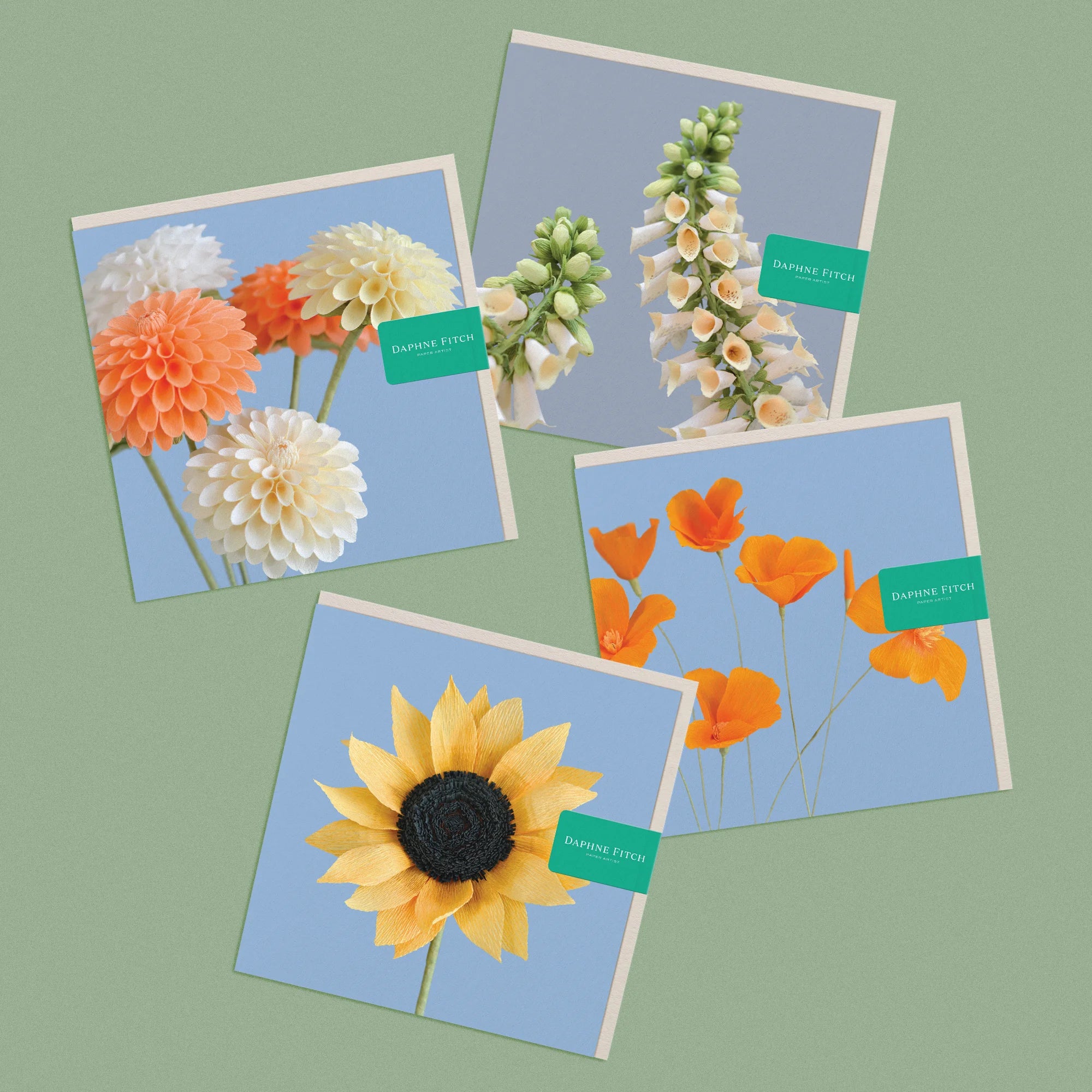Set of 4 greeting cards, with images of a handcrafted paper daliahs, foxglove, sunflower and californian poppies by paper artist Daphne Fitch.