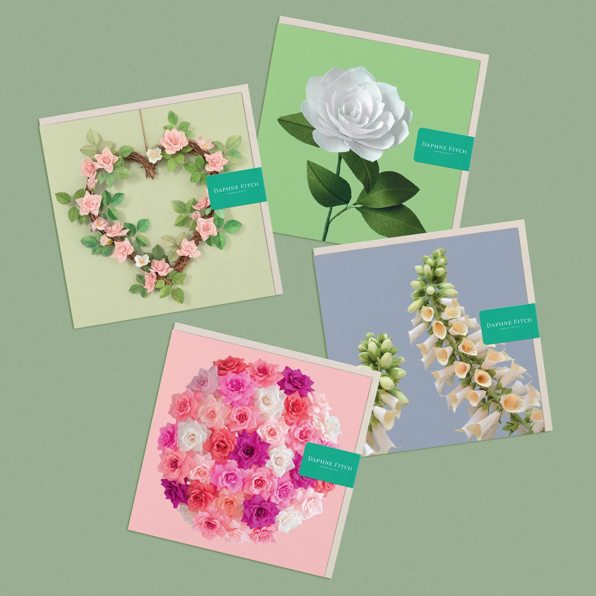 Set of 4 greeting cards, with images of a handcrafted paper rose wreath, camellia, rose bombe and foxglove by paper artist Daphne Fitch.